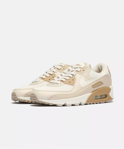 Beige sneaker with brown accents on a white background